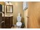 Bathroom featuring a vanity and toilet, lit by modern light fixture at 2501 18Th S Ave, St Petersburg, FL 33712