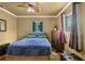 Comfortable bedroom with a ceiling fan and a window providing natural light at 2501 18Th S Ave, St Petersburg, FL 33712