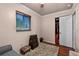 Bedroom featuring a window, closet, area rug and a comfortable gray love seat at 2501 18Th S Ave, St Petersburg, FL 33712