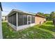 Exterior view of a sun room and fenced in backyard at 2501 18Th S Ave, St Petersburg, FL 33712
