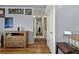 Hallway featuring hardwood floors and neutral walls, plus a display table and decor at 2501 18Th S Ave, St Petersburg, FL 33712