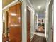 Hallway with hardwood floors, white trim, and multiple doorways leading to other rooms at 2501 18Th S Ave, St Petersburg, FL 33712