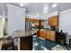 Charming kitchen featuring wood cabinets, stainless refrigerator, and tile backsplash at 2501 18Th S Ave, St Petersburg, FL 33712