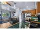 The kitchen has a center island, stainless steel appliances, and wood cabinets at 2501 18Th S Ave, St Petersburg, FL 33712