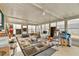 Spacious sun room with tile flooring and fans at 2501 18Th S Ave, St Petersburg, FL 33712