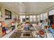 Spacious sun room with tile flooring and fans at 2501 18Th S Ave, St Petersburg, FL 33712