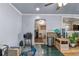 Bright living room with an open layout featuring tile and wood flooring at 2501 18Th S Ave, St Petersburg, FL 33712