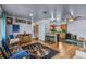 View of living room with hardwood floors, a ceiling fan, and an open connection to the kitchen at 2501 18Th S Ave, St Petersburg, FL 33712