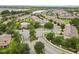 High aerial view of a Primary-planned community with townhomes, a pool, a clubhouse, and a lake backdrop at 2628 Oleander Lakes Dr, Brandon, FL 33511