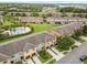 Aerial view of the community with a pool, landscaping, and private parking at 2628 Oleander Lakes Dr, Brandon, FL 33511