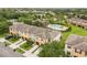 Aerial view of the community with a pool, landscaping, and private parking at 2628 Oleander Lakes Dr, Brandon, FL 33511