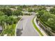 Community entrance featuring a gated entry, lush landscaping, and palm trees at 2628 Oleander Lakes Dr, Brandon, FL 33511