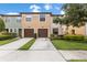 Charming townhome featuring a two-car garage and well-maintained landscaping at 2628 Oleander Lakes Dr, Brandon, FL 33511