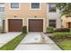 Charming townhome featuring a two-car garage and well-maintained landscaping at 2628 Oleander Lakes Dr, Brandon, FL 33511