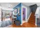 Inviting foyer with hardwood floors, colorful accent wall, stairway, and ample natural light at 2628 Oleander Lakes Dr, Brandon, FL 33511