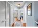 Hallway features hardwood floors, closets, and access to bedrooms at 2628 Oleander Lakes Dr, Brandon, FL 33511