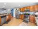 Well-equipped kitchen featuring stainless steel appliances, ample counter space, and tile flooring at 2628 Oleander Lakes Dr, Brandon, FL 33511