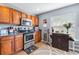 Kitchen area featuring stainless steel appliances, wooden cabinets, and a breakfast nook at 2628 Oleander Lakes Dr, Brandon, FL 33511