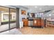 A bright kitchen with stainless steel appliances and sliding glass doors to the screened lanai at 2628 Oleander Lakes Dr, Brandon, FL 33511