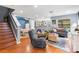 Cozy living room with hardwood floors, recessed lighting, and a comfortable seating area at 2628 Oleander Lakes Dr, Brandon, FL 33511
