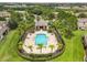 A beautiful community pool is surrounded by palm trees at 2628 Oleander Lakes Dr, Brandon, FL 33511