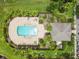 A bird's eye view of the pool, community room and a parking area at 2628 Oleander Lakes Dr, Brandon, FL 33511