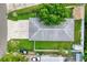Aerial view of home featuring a driveway, roof, and fenced backyard at 2715 Bel Aire Cir, Tampa, FL 33614