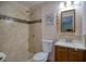 Bathroom featuring tiled walk-in shower and wooden vanity at 2715 Bel Aire Cir, Tampa, FL 33614