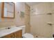 Bathroom featuring a tiled walk-in shower, updated vanity, and attractive fixtures at 2715 Bel Aire Cir, Tampa, FL 33614