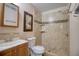 Bathroom featuring a tiled walk-in shower, updated vanity, and attractive fixtures at 2715 Bel Aire Cir, Tampa, FL 33614