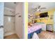 This bedroom features a cozy sleeping area and a bathroom with a tiled walk-in shower at 2715 Bel Aire Cir, Tampa, FL 33614