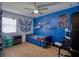 Bedroom featuring an accent wall, natural lighting, and hardwood flooring at 2715 Bel Aire Cir, Tampa, FL 33614