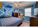 Bedroom features an accent wall, natural lighting, and hardwood flooring at 2715 Bel Aire Cir, Tampa, FL 33614