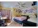 Bright bedroom with wood-look tile flooring, ceiling fan, and large windows at 2715 Bel Aire Cir, Tampa, FL 33614