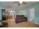 Spacious living room with wood-look flooring and a view into the kitchen at 2715 Bel Aire Cir, Tampa, FL 33614
