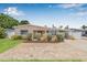Charming home featuring a nicely landscaped front yard and a brick paved driveway at 2861 Pinellas Point S Dr, St Petersburg, FL 33712