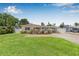 Charming home boasts a well-manicured lawn and a welcoming brick walkway, leading to a covered carport at 2861 Pinellas Point S Dr, St Petersburg, FL 33712
