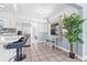 Eat-in kitchen featuring sleek countertops, stainless steel appliances, tile floors, and a breakfast nook at 2861 Pinellas Point S Dr, St Petersburg, FL 33712