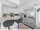 Modern kitchen with stainless steel appliances, marble countertops, white cabinetry and a stylish backsplash at 2861 Pinellas Point S Dr, St Petersburg, FL 33712