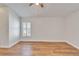 Bedroom features wood-look floors and a shuttered window at 304 Caloosa Palms Ct, Sun City Center, FL 33573