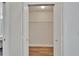 Bright closet featuring shelving and hardwood floor, perfect for storage at 304 Caloosa Palms Ct, Sun City Center, FL 33573