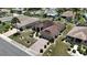 Attractive aerial view of a home featuring manicured landscaping and a spacious two car driveway at 304 Caloosa Palms Ct, Sun City Center, FL 33573