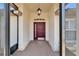 Elegant front door with transom window and sidelights, creating a welcoming entrance at 304 Caloosa Palms Ct, Sun City Center, FL 33573