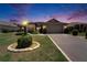 Charming single-story home featuring a well-manicured lawn, lovely landscaping, and a two-car garage at 304 Caloosa Palms Ct, Sun City Center, FL 33573