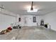 Spacious garage featuring shelving and ample room for storage and projects at 304 Caloosa Palms Ct, Sun City Center, FL 33573