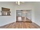 Bright living room featuring hardwood floors, open layout, and seamless transition to other living spaces at 304 Caloosa Palms Ct, Sun City Center, FL 33573