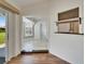 Bright living room featuring hardwood floors, open layout with great lighting and a view to the backyard at 304 Caloosa Palms Ct, Sun City Center, FL 33573