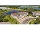 Aerial view of the rear of townhomes located near a retention pond at 308 Mangrove Shade Cir, Apollo Beach, FL 33572