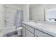 Bright bathroom featuring a tub/shower combo, toilet and sink vanity with counter space at 308 Mangrove Shade Cir, Apollo Beach, FL 33572