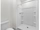 A bathroom features a walk-in shower and modern fixtures at 308 Mangrove Shade Cir, Apollo Beach, FL 33572